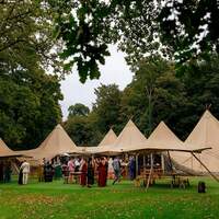 FRONT OF TIPIS GUESTS
