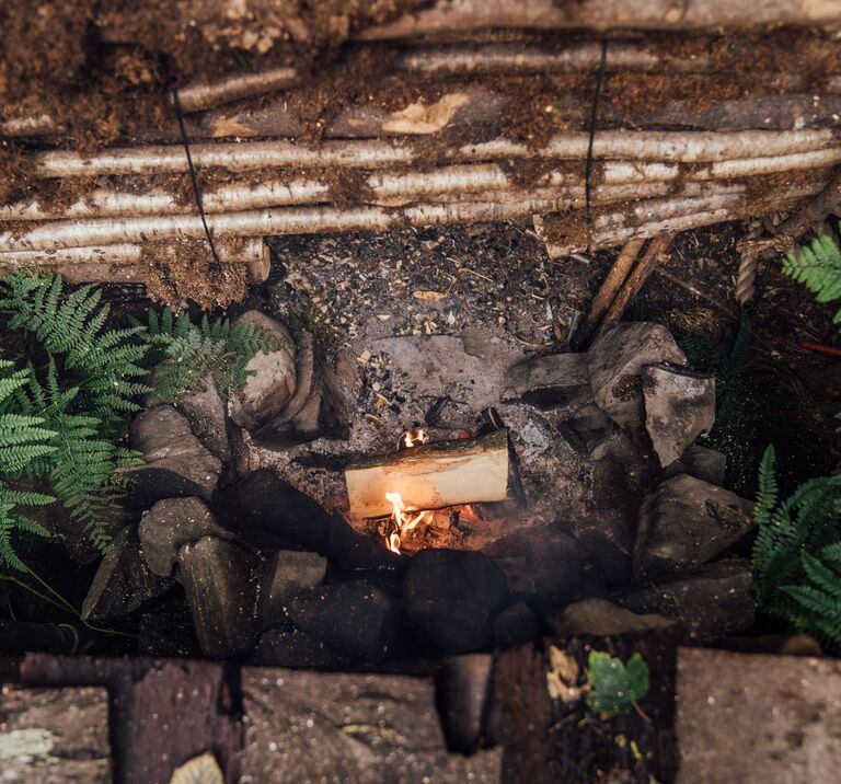 Camp fire at Bushcamp, warming up guests at our Finnebrogue Woods School of Bushcraft