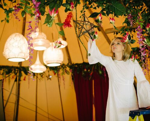Rachael from Blue Moon Event Design decorates the Tipis at Finnebrogue Woods with wild foliage and Arabian lamp chandeliers